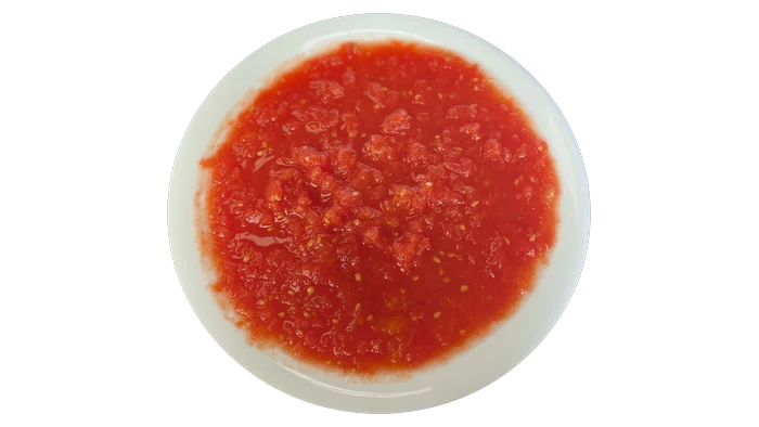 Dish of grated chopped tomato